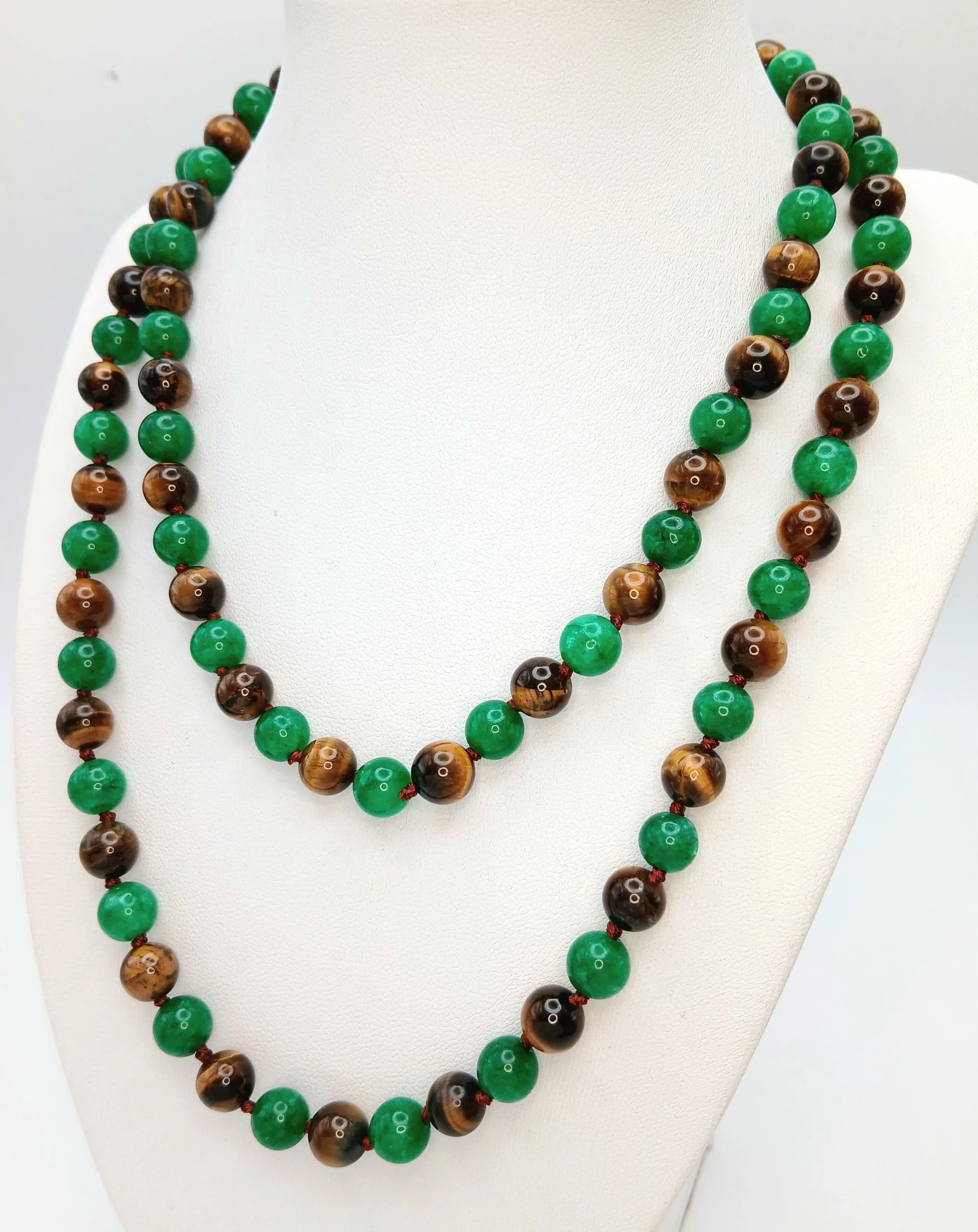 A Jade and Tigers Eye Beaded Necklace. 8mm beads. 90cm length.