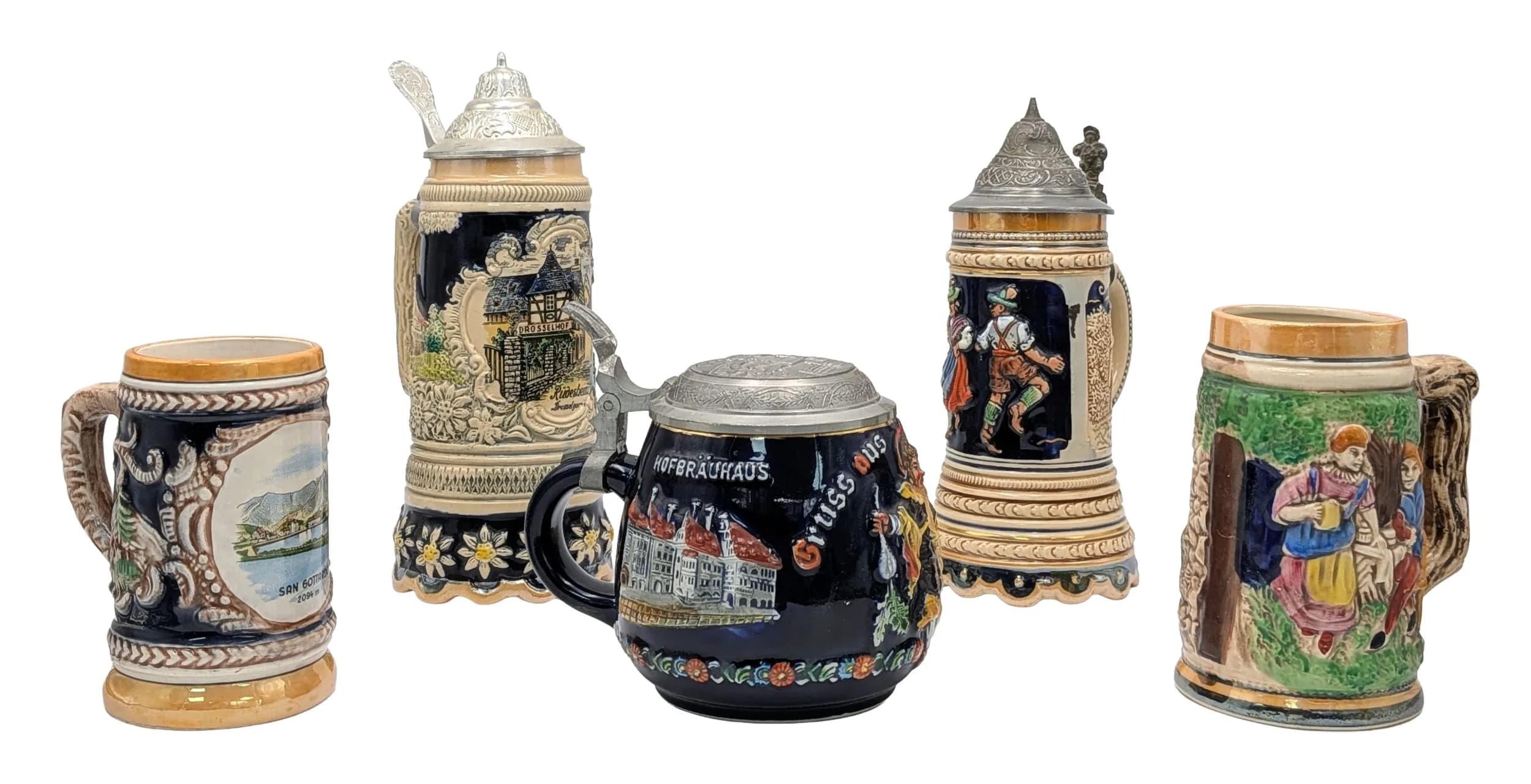 A collection of five vintage German beer steins. Including two with Swiss musical movements in the bottom and pewter lids. Very nice condition.