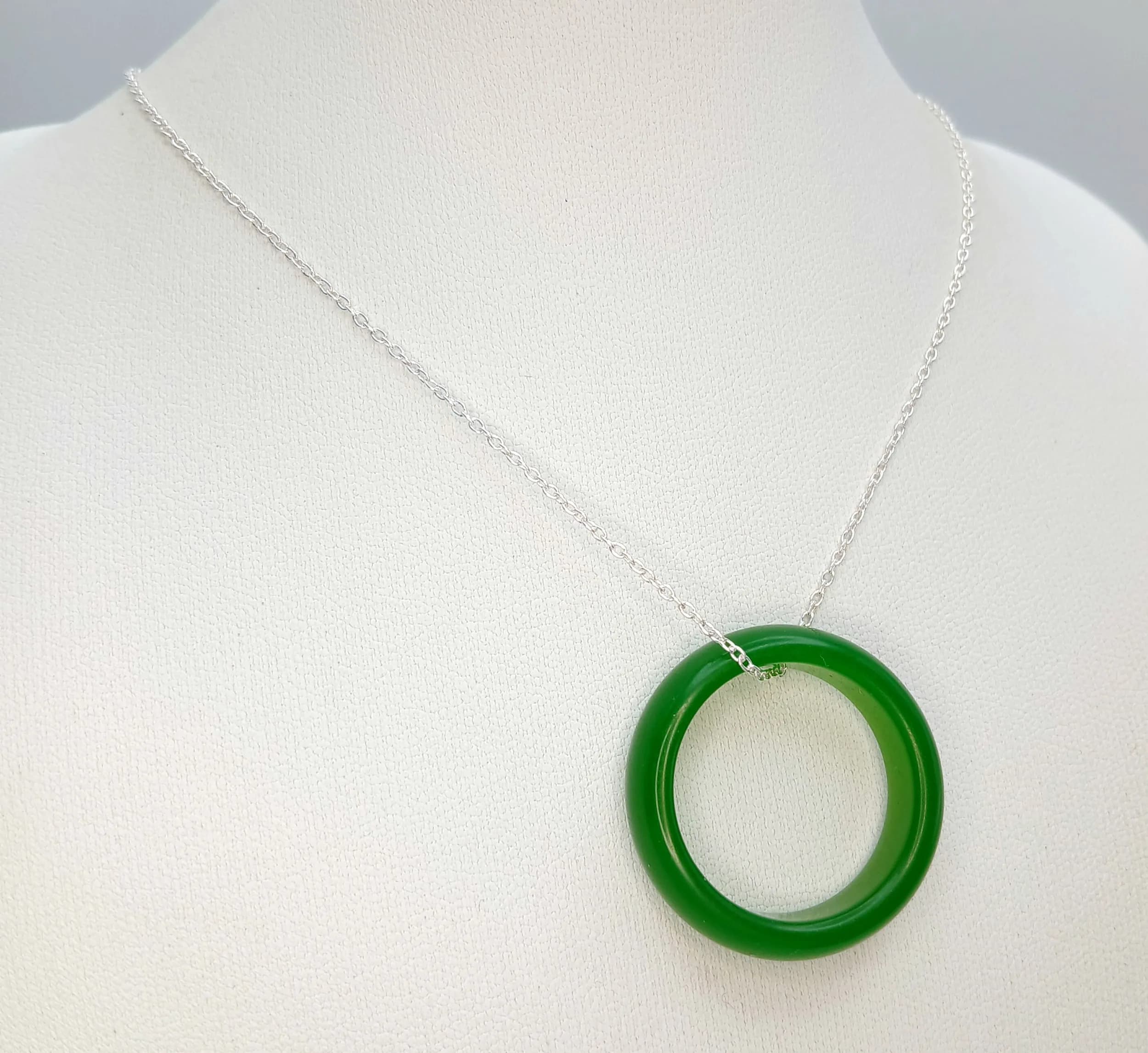 A Jade Large Ring/Pendant on a Silver Chain. 3cm diameter. 42cm chain.