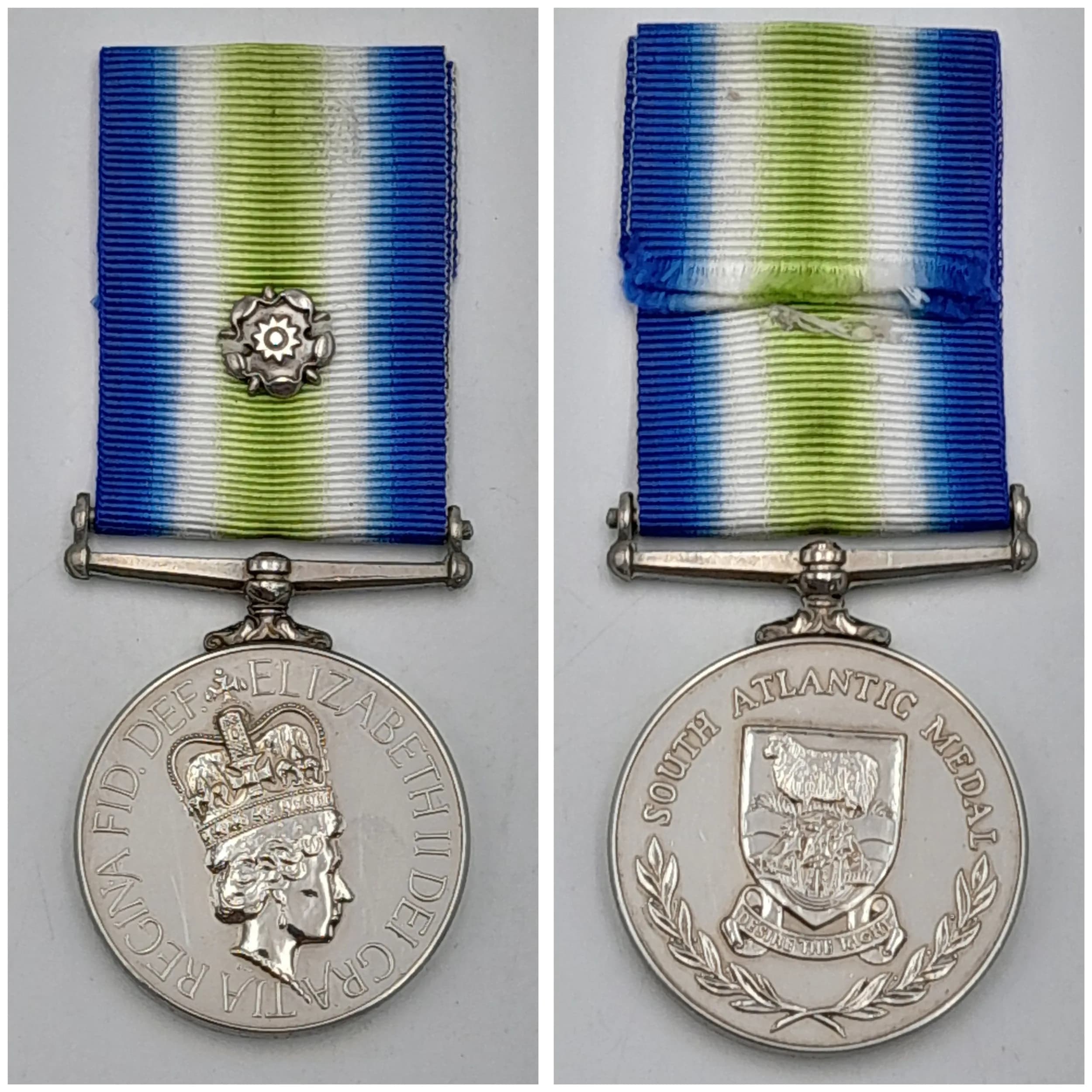 A South Atlantic Medal 1982, with Rosette, named to: 24583379 Sig M Reid R Signals.Signalman Reid was a member of the detachment from 30 Signal Regiment (Strategic Reserve) sent to the Falklands to provide tactical satellite communications (TSC 501) from the Islands to the UK.Royal Signals suffered a number of prominent casualties during the campaign; Lieut Jim Barry, serving as a platoon commander with 2 Para, was killed in the infamous ‘White Flag’ incident during the battle for Goose Green, when Argentine troops feigned surrender by showing a white flag and then fired on Lieut Barry as he came forward to accept their surrender; Major Mike Forge and SSgt Joe Baker were killed with their AAC crew when their helicopter was shot down by an Argentine Puccara fighter; five soldiers from 264 (SAS) Signal Squadron were killed when their helicopter ditched in heavy seas during a ‘cross-decking’ flight.Accompanied by copy notes on Royal Signals deployment for Op CORPORATE, including photographs of a 30 Signal Regiment TSC 501 detachment (which may include Sig Reid).Good Very Fine (GVF) Condition.