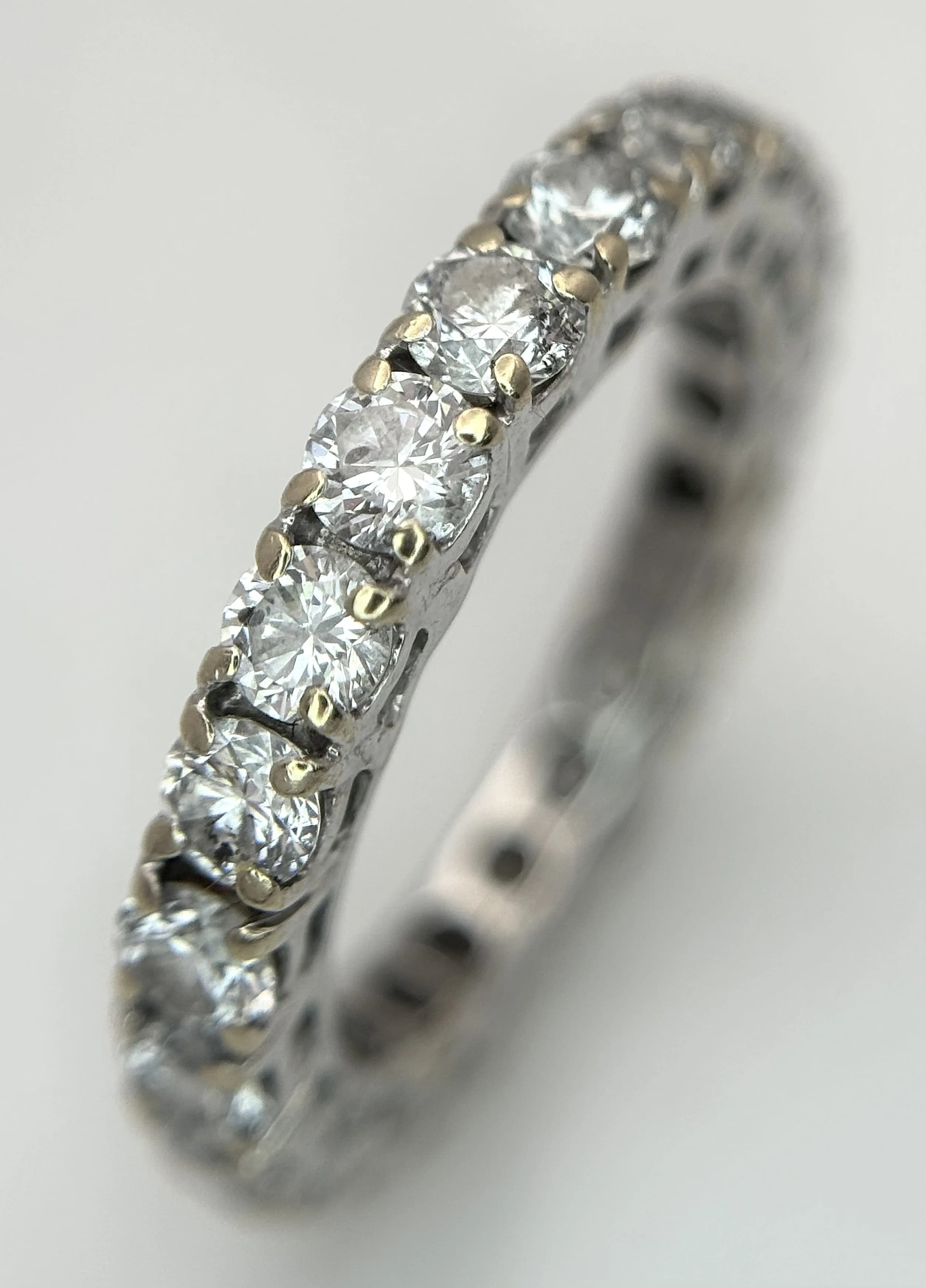 An 18K White Gold and Diamond Eternity Ring